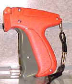 Fine fabric tagging gun with pistol grip.